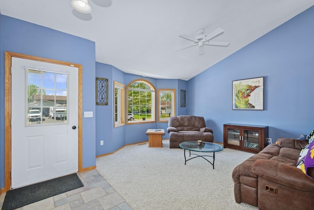 402 13th Ave NE, Buffalo, MN 55313 - carpeted living room featuring a ceiling fan, vaulted ceiling, baseboards, and stone finish flooring