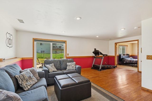 402 13th Ave NE, Buffalo, MN 55313 - living room featuring healthy amount of natural light, wood finished floors, and recessed lighting