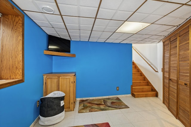 402 13th Ave NE, Buffalo, MN 55313 - finished below grade area featuring stairway, tile patterned floors, and baseboards