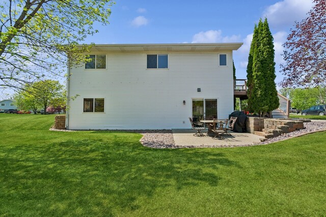 402 13th Ave NE, Buffalo, MN 55313 - back of house with a yard, a patio area, and a wooden deck