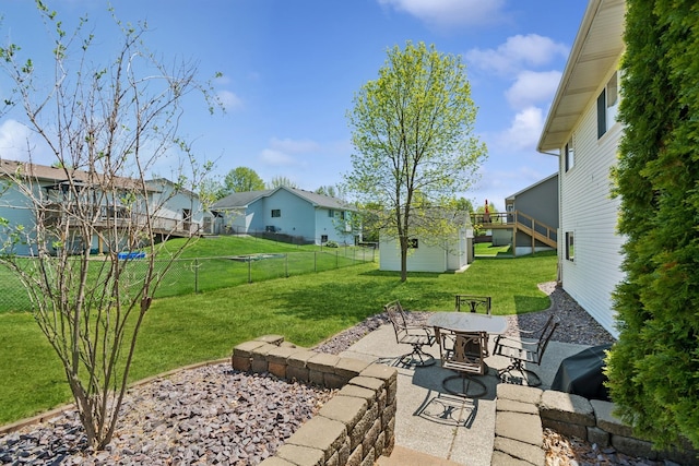 402 13th Ave NE, Buffalo, MN 55313 - view of yard featuring a patio area, a residential view, an outbuilding, and outdoor dining area