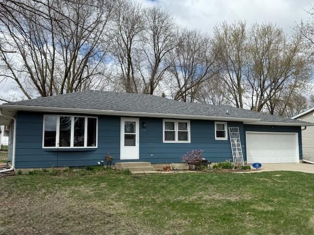 single story home with a garage, driveway, and a front yard