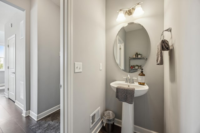 4343 Corn Silk Ln, Woodbury, MN 55129 - bathroom with baseboards and tile patterned floors