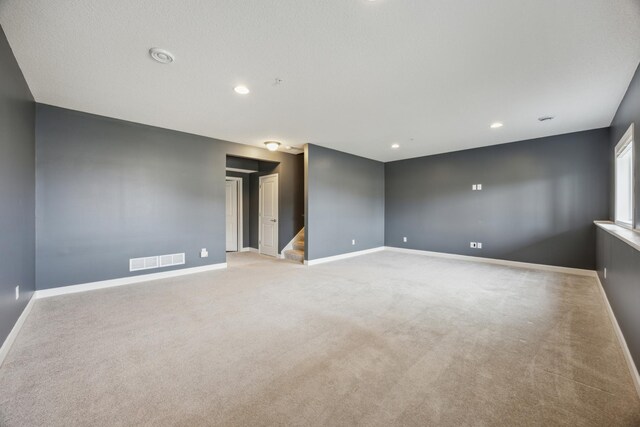 4343 Corn Silk Ln, Woodbury, MN 55129 - spare room with light colored carpet, stairway, and recessed lighting