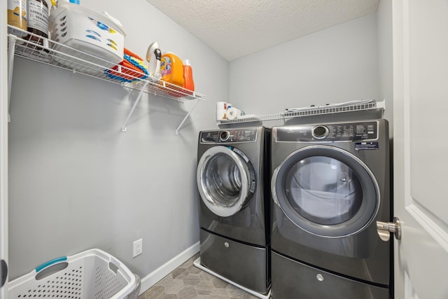 4343 Corn Silk Ln, Woodbury, MN 55129 - washroom featuring washer and clothes dryer and a textured ceiling