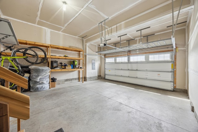 4343 Corn Silk Ln, Woodbury, MN 55129 - garage featuring a garage door opener and electric panel