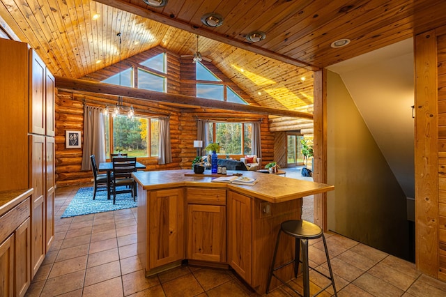 2374 320th St, Forest Twp, WI 54005 - kitchen with rustic walls, open floor plan, a kitchen island, and wood ceiling