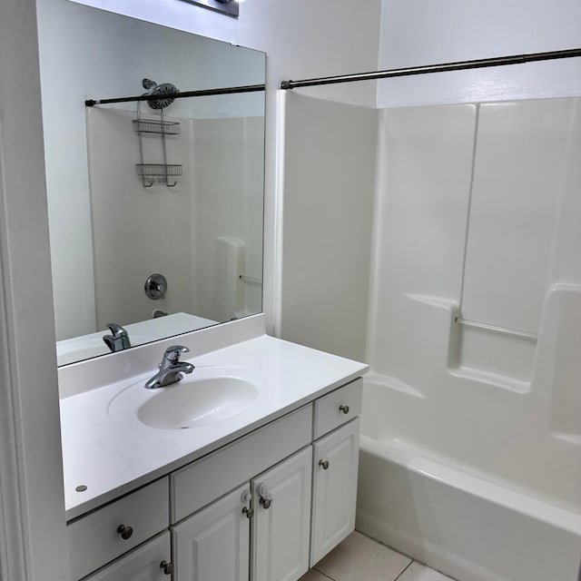 bathroom with vanity, tile patterned flooring, and bathing tub / shower combination