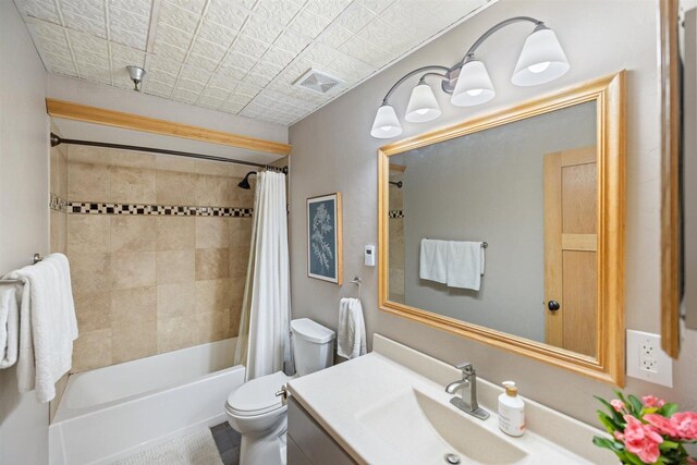 bathroom featuring toilet, vanity, and shower / bath combination with curtain