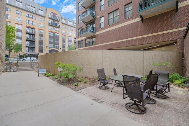 view of patio featuring fence