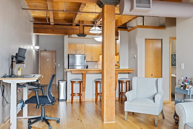 400 1st St Unit 507, Minneapolis, MN 55401 - kitchen with freestanding refrigerator, a wood ceiling with exposed beams, light wood finished floors, hanging light fixtures, and an office area