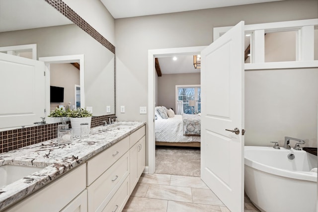 ensuite bathroom with ensuite bath, decorative backsplash, double vanity, marble finish floor, and a soaking tub