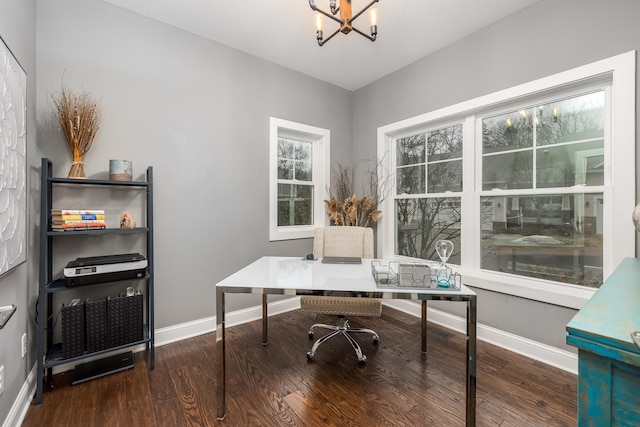 office area featuring a notable chandelier, wood finished floors, and baseboards