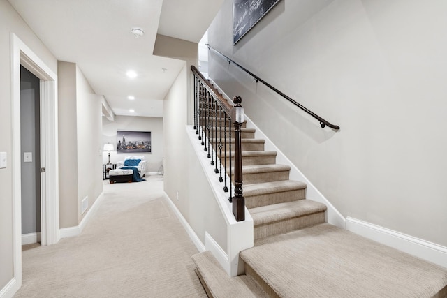 stairway with recessed lighting, carpet flooring, and baseboards