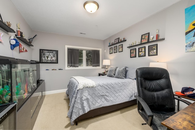 bedroom with baseboards, visible vents, and carpet flooring