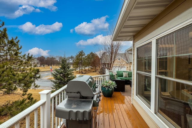 wooden terrace with area for grilling