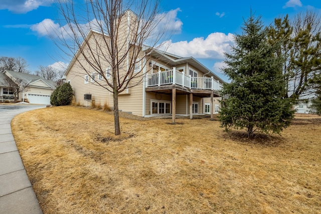 view of property exterior featuring a wooden deck and a chimney