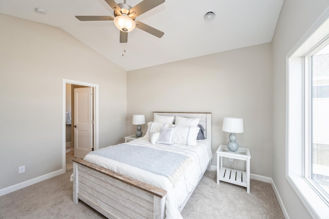 carpeted bedroom featuring baseboards, visible vents, multiple windows, and vaulted ceiling