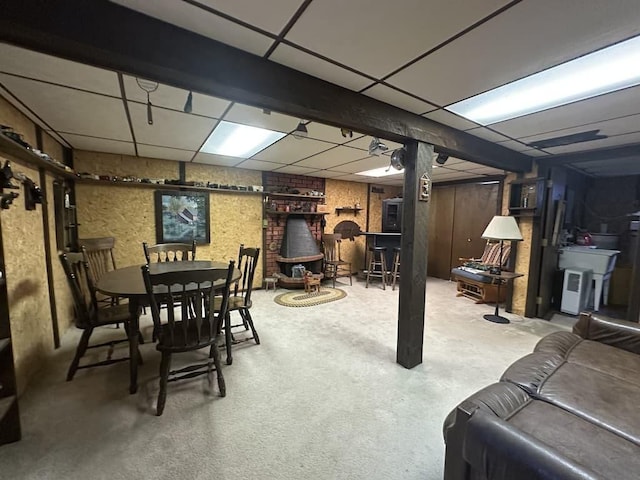 finished basement with a paneled ceiling