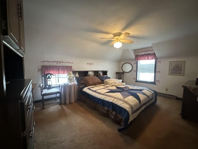 bedroom featuring lofted ceiling, ceiling fan, carpet floors, and multiple windows