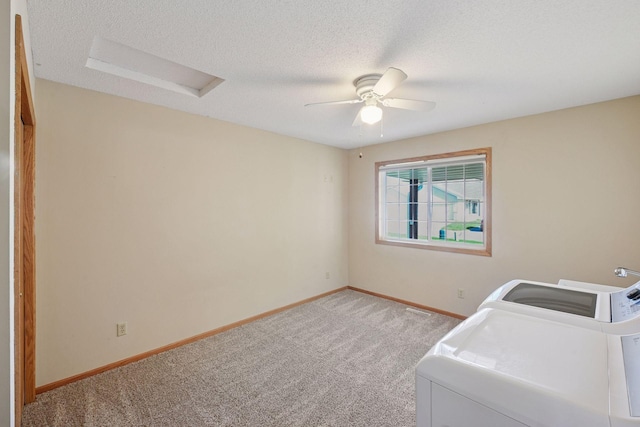 laundry room featuring laundry area, attic access, baseboards, light carpet, and washer and dryer