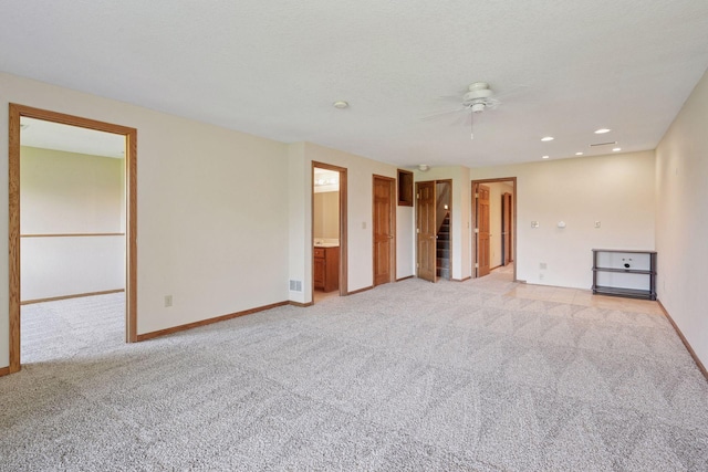 unfurnished room featuring baseboards, light carpet, a ceiling fan, and recessed lighting