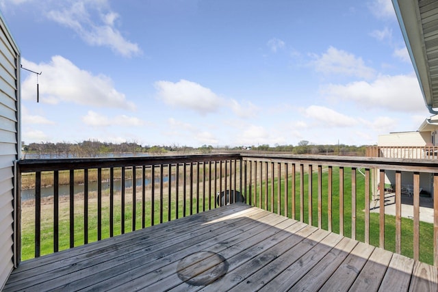 deck featuring a lawn