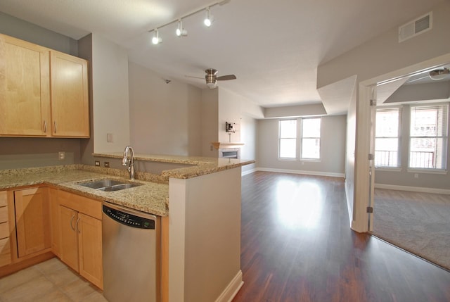 620 Main St N Unit 215, Stillwater, MN 55082 - kitchen featuring a sink, a peninsula, open floor plan, stainless steel dishwasher, and visible vents