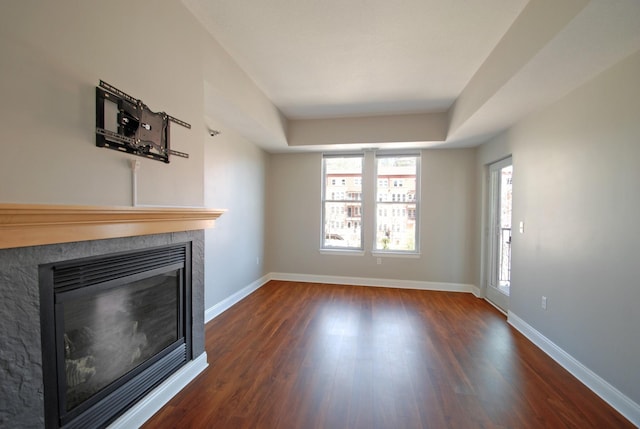 620 Main St N Unit 215, Stillwater, MN 55082 - unfurnished living room with a glass covered fireplace, baseboards, and wood finished floors