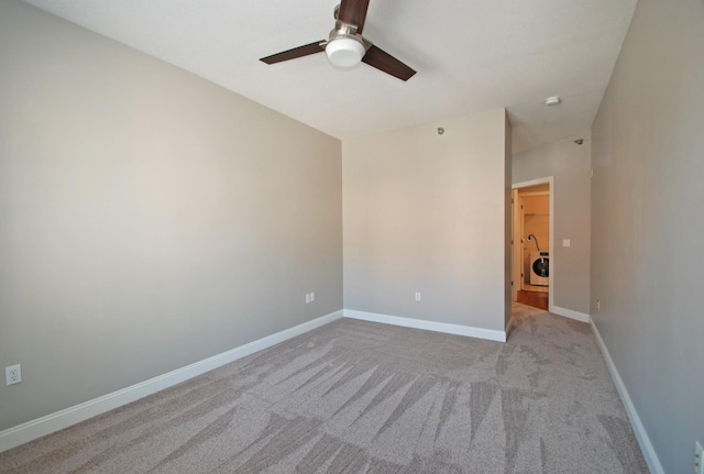 620 Main St N Unit 215, Stillwater, MN 55082 - unfurnished room featuring carpet floors, a ceiling fan, baseboards, and washer / dryer
