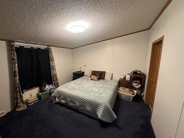 carpeted bedroom featuring ornamental molding and a textured ceiling