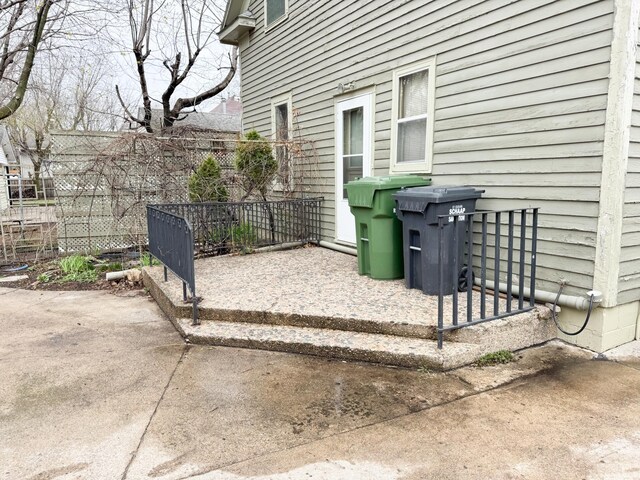 view of patio featuring fence