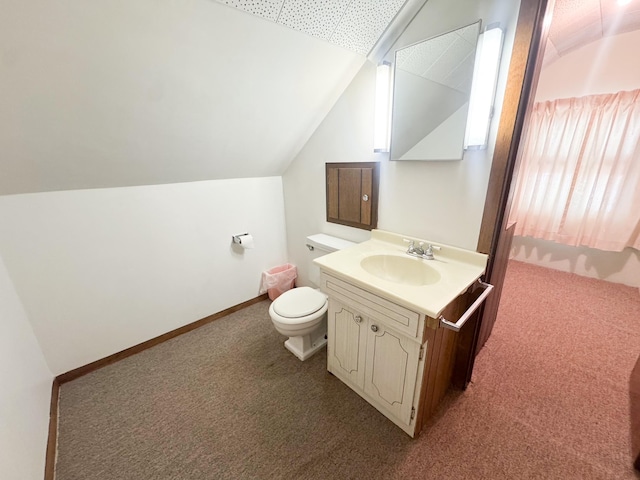 half bath with lofted ceiling, toilet, and vanity