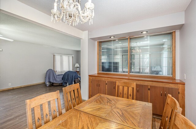 5870 Lynwood Blvd, Mound, MN 55364 - dining room featuring a chandelier, wood finished floors, and a textured ceiling