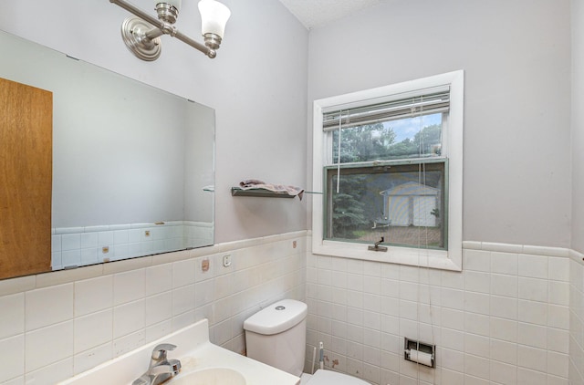 5870 Lynwood Blvd, Mound, MN 55364 - half bath with tile walls, wainscoting, and vanity