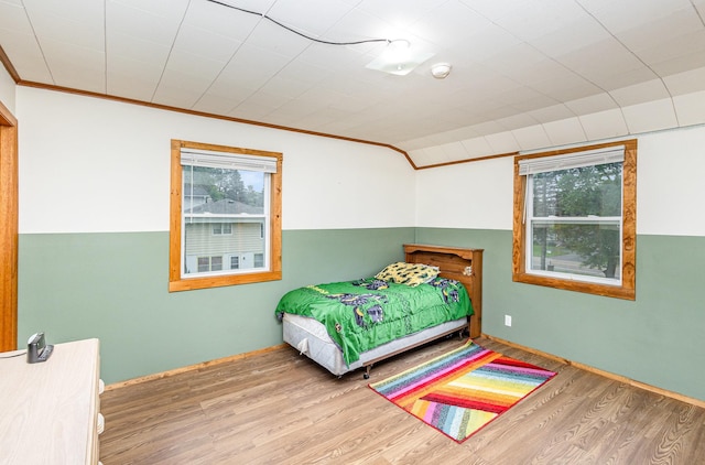 5870 Lynwood Blvd, Mound, MN 55364 - bedroom featuring multiple windows, wood finished floors, and crown molding