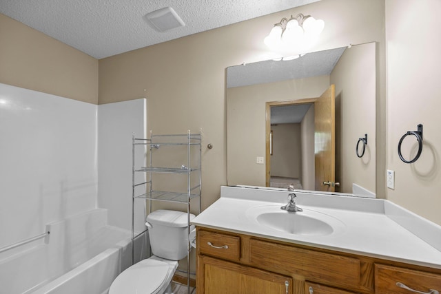 426 Dillon Ave N, Montrose, MN 55363 - full bathroom featuring toilet, vanity, a textured ceiling, and bathtub / shower combination