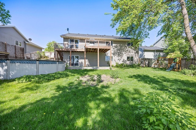 426 Dillon Ave N, Montrose, MN 55363 - rear view of property with a wooden deck and a playground