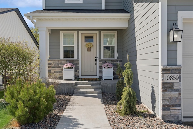 10859 23rd St NE, Saint Michael, MN 55376 - doorway to property featuring stone siding and covered porch