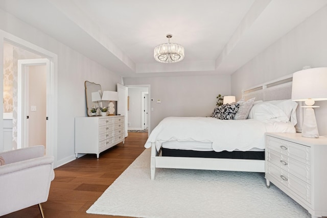 10859 23rd St NE, Saint Michael, MN 55376 - bedroom with wood finished floors, a chandelier, a raised ceiling, and baseboards