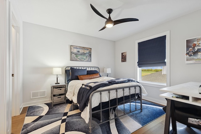 10859 23rd St NE, Saint Michael, MN 55376 - bedroom with baseboards, a ceiling fan, and wood finished floors