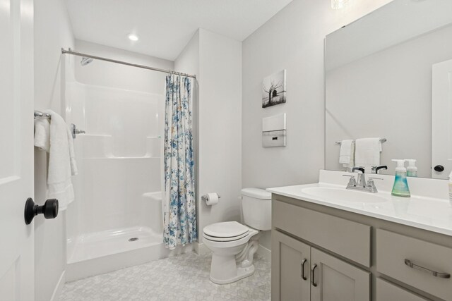 10859 23rd St NE, Saint Michael, MN 55376 - bathroom featuring toilet, a stall shower, vanity, and baseboards