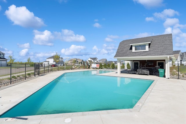 10859 23rd St NE, Saint Michael, MN 55376 - community pool with fence, a patio area, a residential view, and an outdoor structure