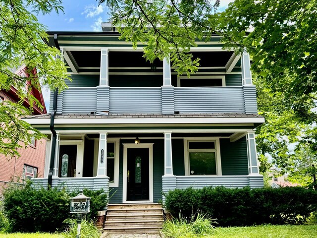 greek revival house with covered porch and a balcony
