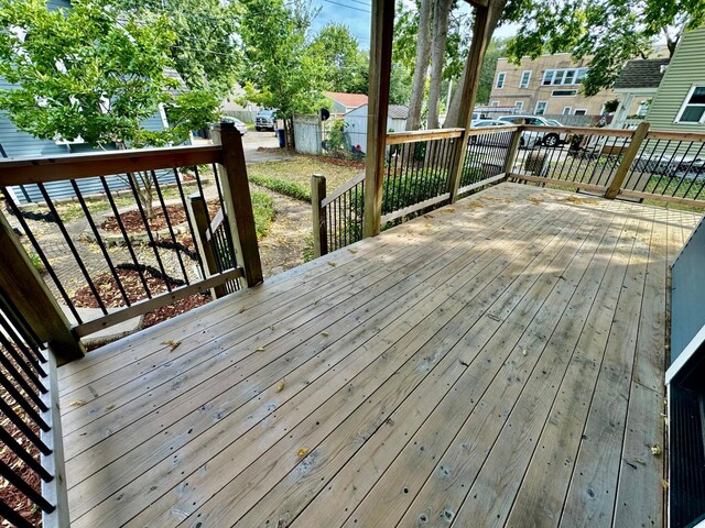 deck featuring fence and a residential view