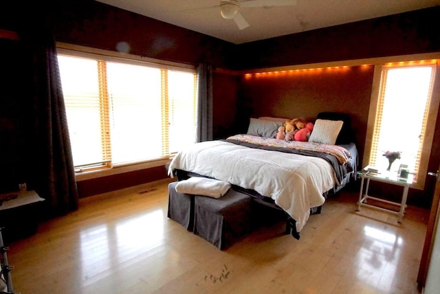 bedroom featuring wood finished floors and a ceiling fan