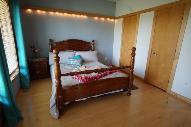 bedroom featuring light wood-style floors