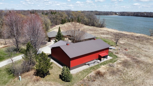 aerial view of property and surrounding area with a large body of water