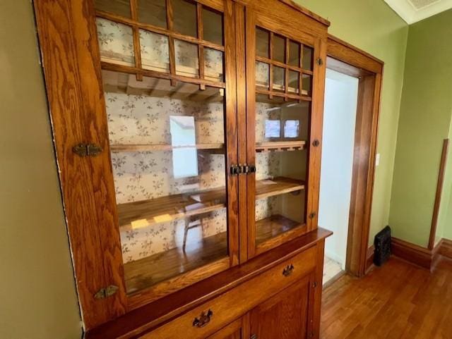 room details with french doors, baseboards, and wood finished floors
