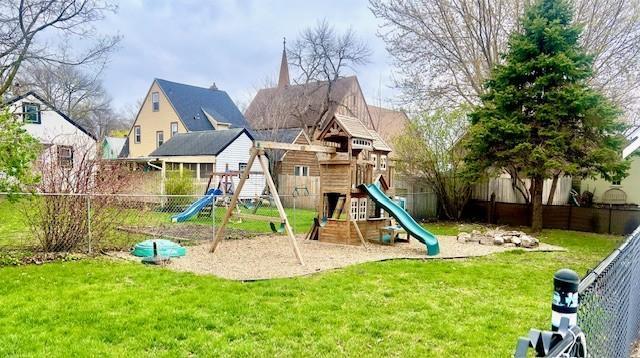 view of play area featuring a yard and fence